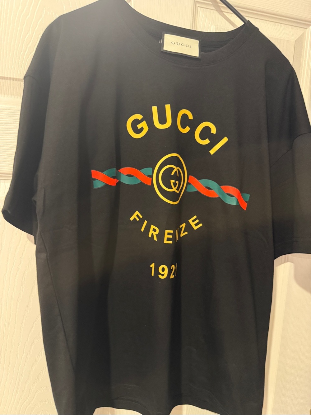 Gucci Black Tee with Yellow Logo and Red-Green Ribbon
